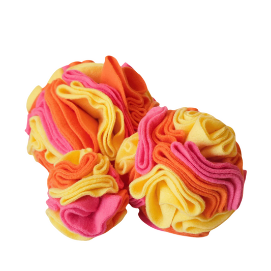 Small, medium and large snuffle balls in colour way Sunshine - yellow, pink and orange. Enrichment toy for pets handmade in New Zealand.